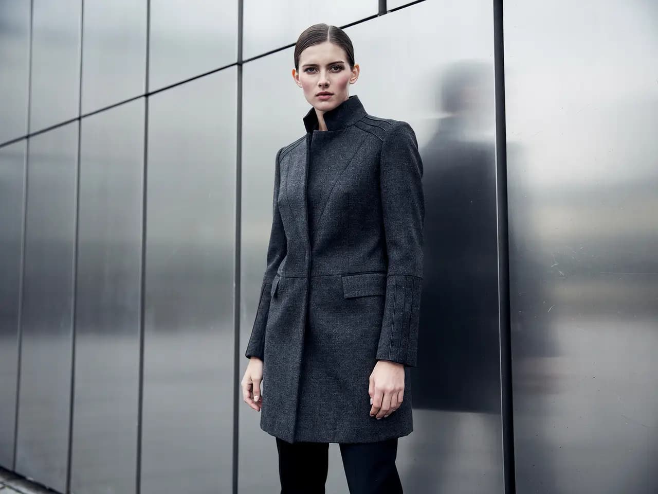 An editorial fashion campaign frame with controlled styling, refined color, and premium lighting.